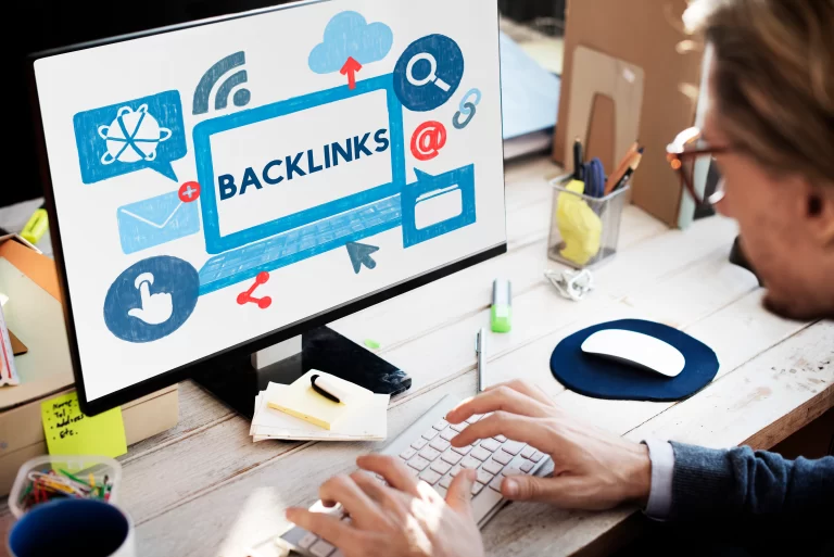 user working on computer with backlinks
